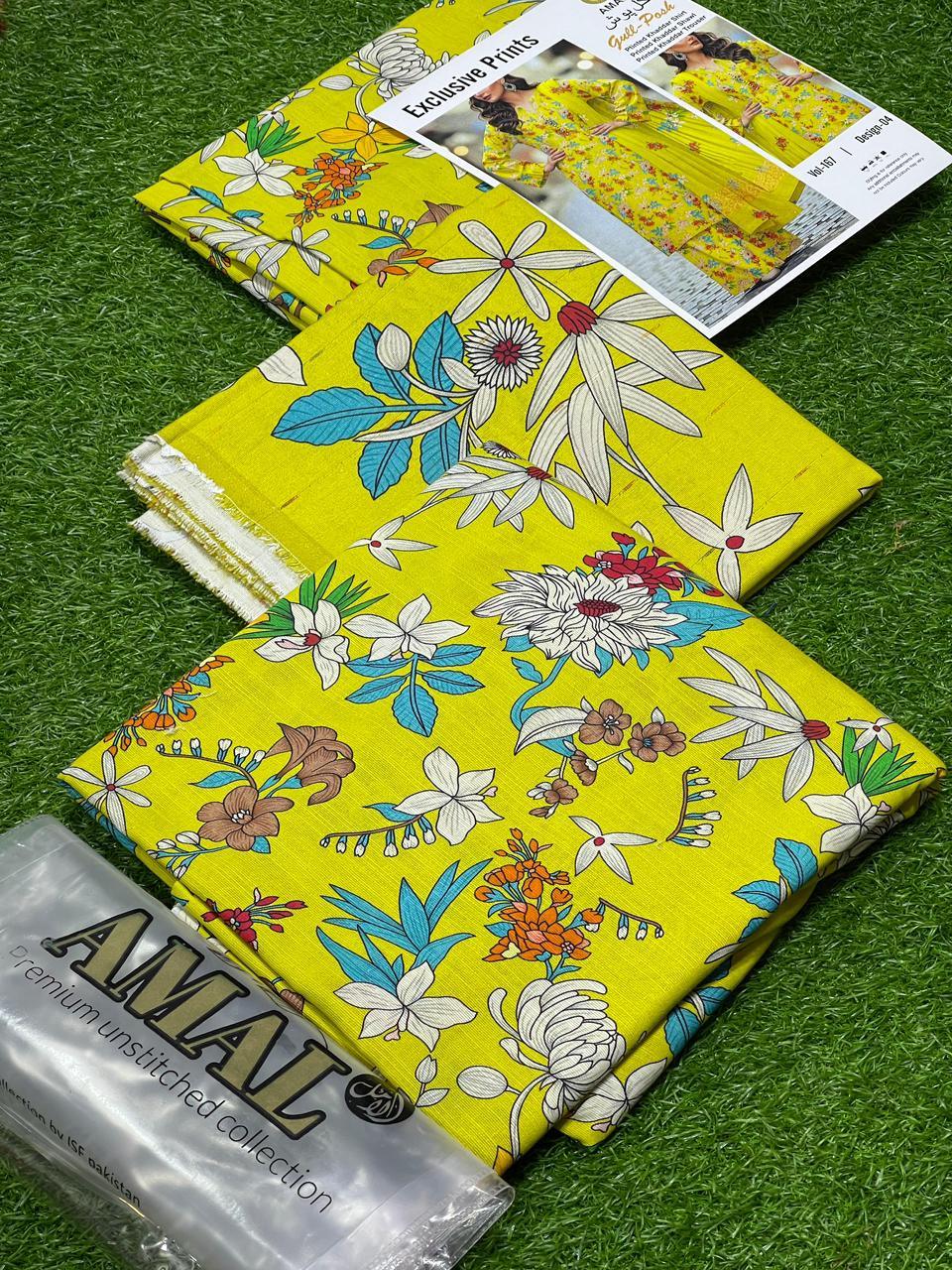 Bright yellow floral printed fabric from AMAL premium unstitched collection on green grass