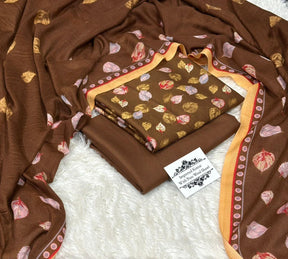 Brown printed fabric set with floral leaf pattern and border, labeled as pure wool Kotrai shawl