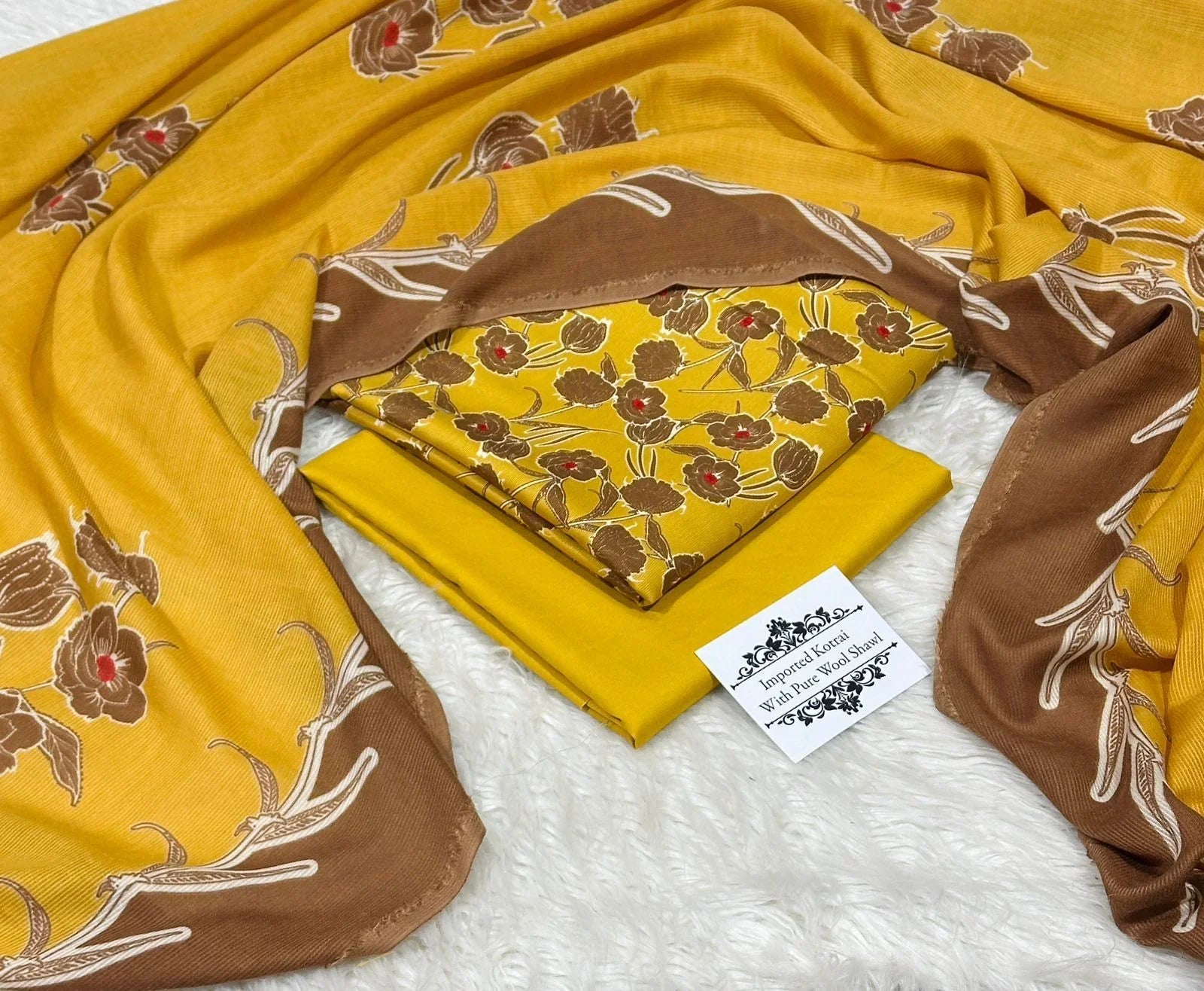 Mustard yellow and brown floral printed pure wool shawl with fabric pieces on white textured background