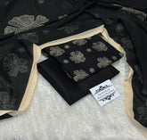 Black fabric with cream floral embroidery and beige border, labeled imported Kotrai with pure wool shawl