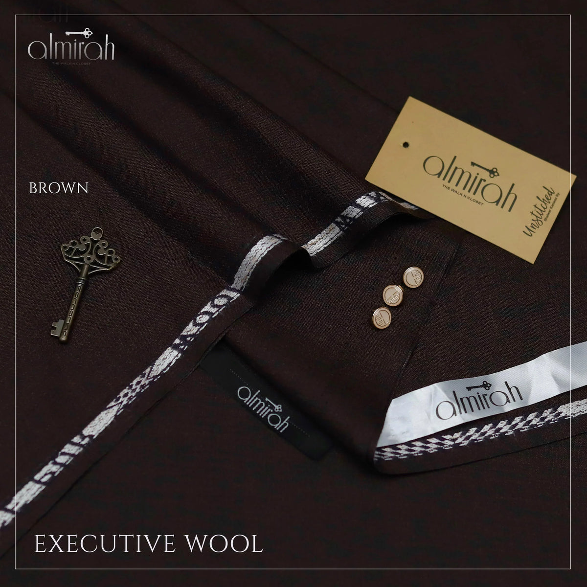 Almirah brown executive wool fabric with white border, branded tags, and vintage key on dark background